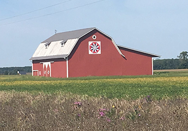 Red Barn with spiral quilt